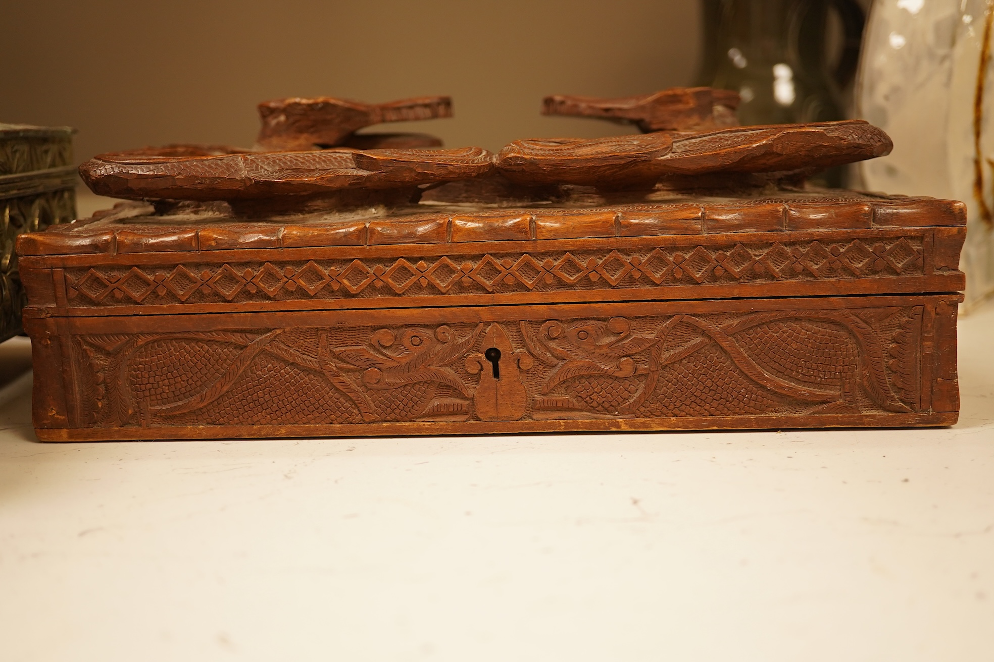 A late 19th century Japanese gilt metal lidded box together with a Burmese carved hardwood box, 28cm wide